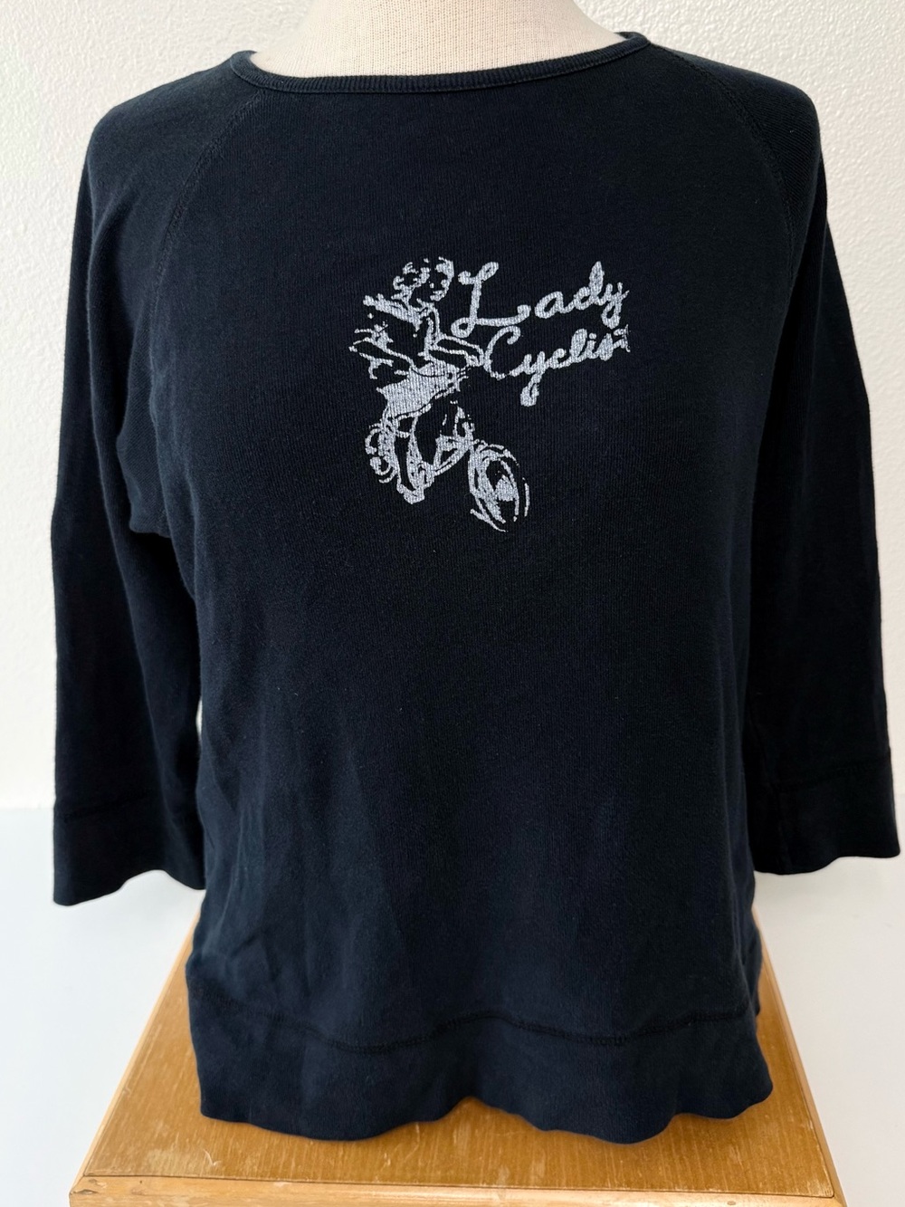 ⁠Atlantique ”Lady Cyclist” Cotton Black 3/4 Raglan Sleeve Graphic Top Size XL